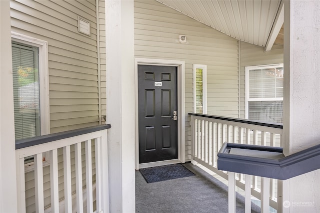 entrance to property featuring a porch