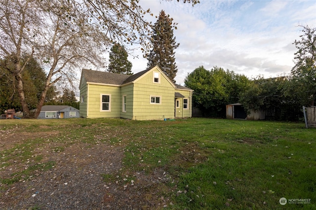 view of side of home featuring a yard