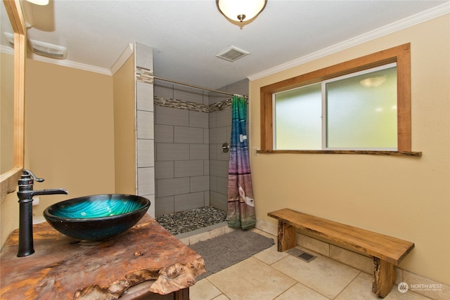 bathroom featuring tile patterned floors, sink, ornamental molding, and a shower with shower curtain