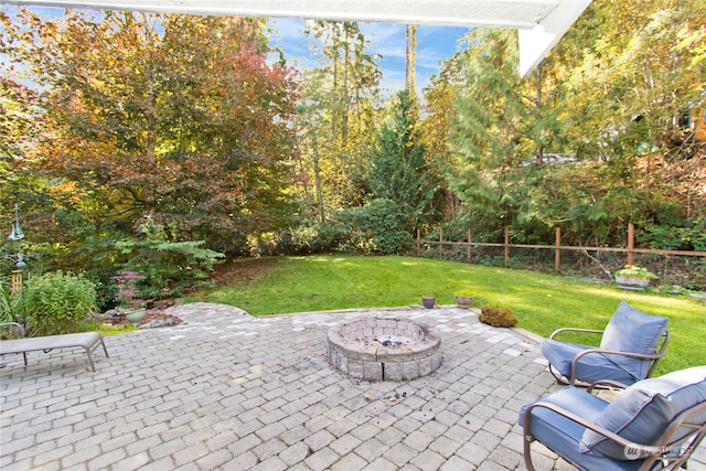 view of patio with a fire pit