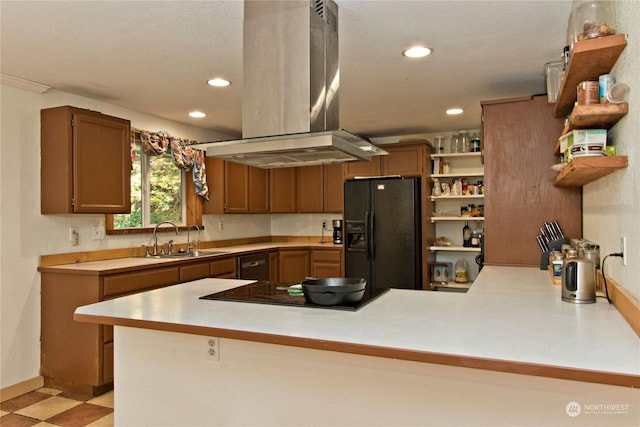 kitchen featuring black appliances, sink, kitchen peninsula, and island exhaust hood