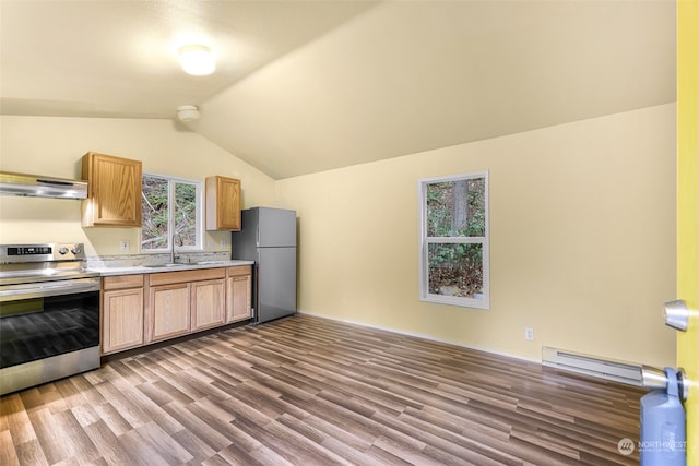 kitchen with a sink, under cabinet range hood, stainless steel appliances, baseboard heating, and vaulted ceiling