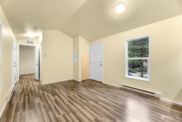 4220 Brays Way, Bellingham, WA 98226 - unfurnished living room featuring a baseboard radiator, wood finished floors, baseboard heating, and vaulted ceiling