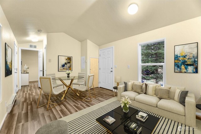 4220 Brays Way, Bellingham, WA 98226 - living area featuring dark wood-style flooring, a baseboard heating unit, and lofted ceiling
