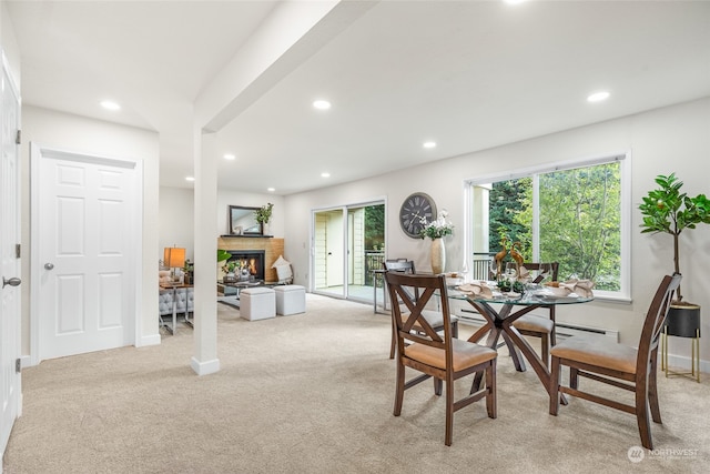 dining area featuring light colored carpet