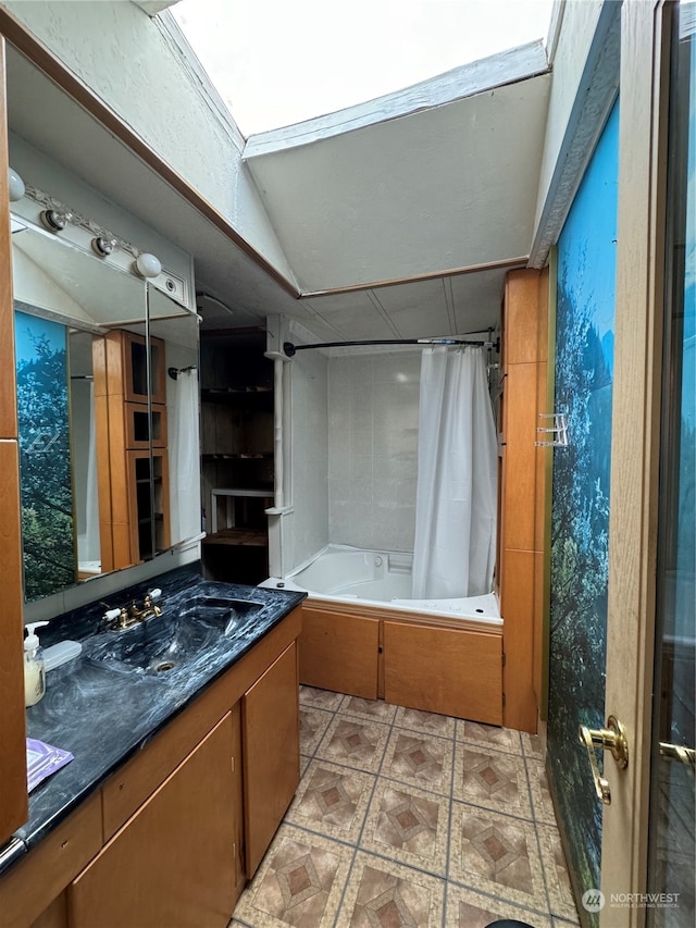 bathroom with vanity, shower / tub combo, and vaulted ceiling