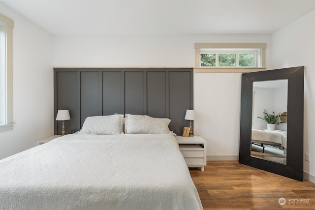 bedroom with wood-type flooring