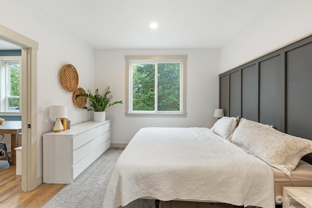 bedroom with light wood-type flooring