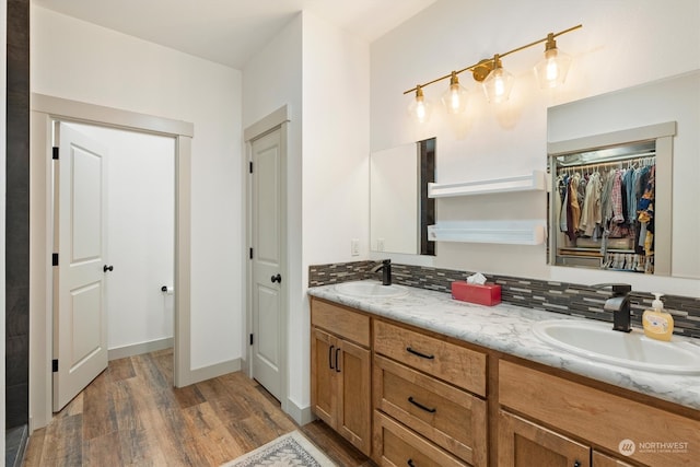 bathroom featuring vanity and hardwood / wood-style flooring