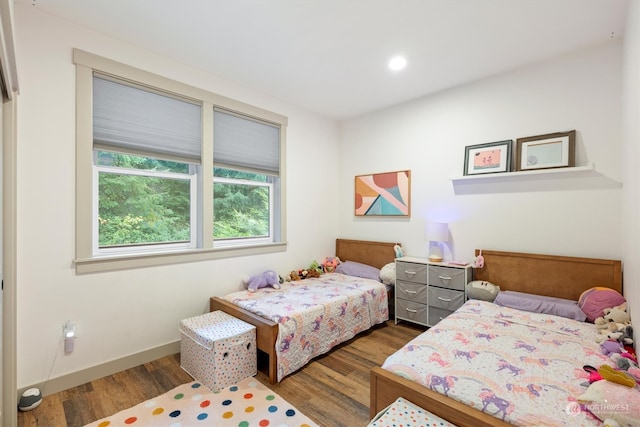 bedroom with hardwood / wood-style flooring