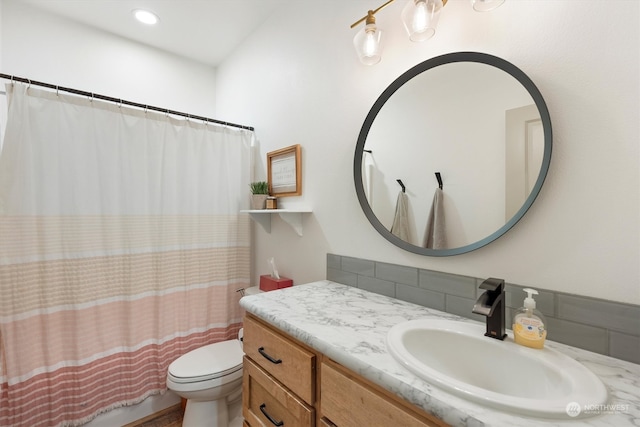 bathroom featuring vanity, toilet, and a shower with shower curtain