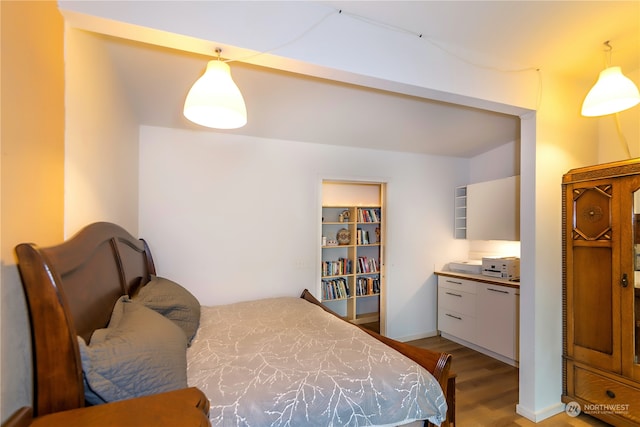 bedroom with light hardwood / wood-style flooring