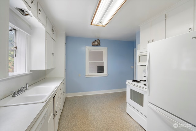 kitchen featuring white cabinetry, white appliances, and sink