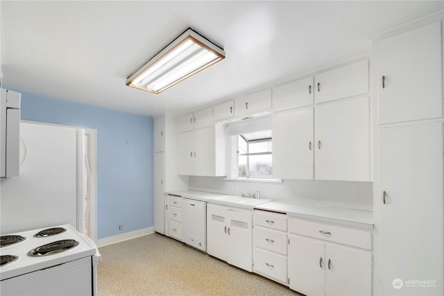 kitchen featuring white cabinetry, sink, and white appliances