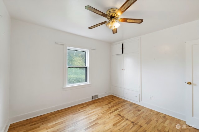 unfurnished bedroom featuring a closet, ceiling fan, and light wood-type flooring