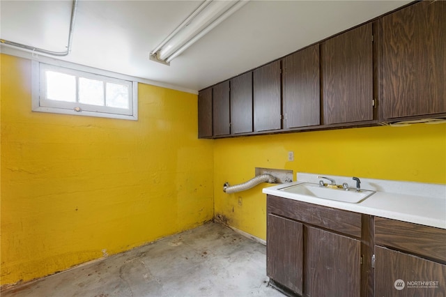 washroom featuring cabinets and sink