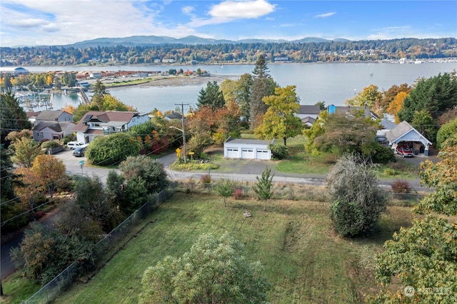 drone / aerial view featuring a water and mountain view