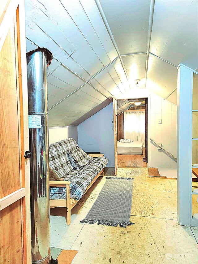 sitting room with vaulted ceiling