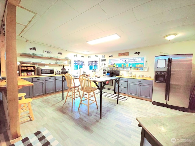 dining area with light wood-type flooring