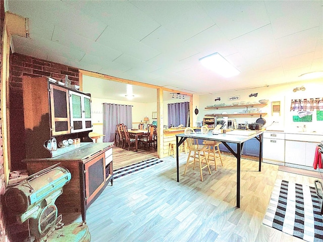 rec room featuring light wood finished floors