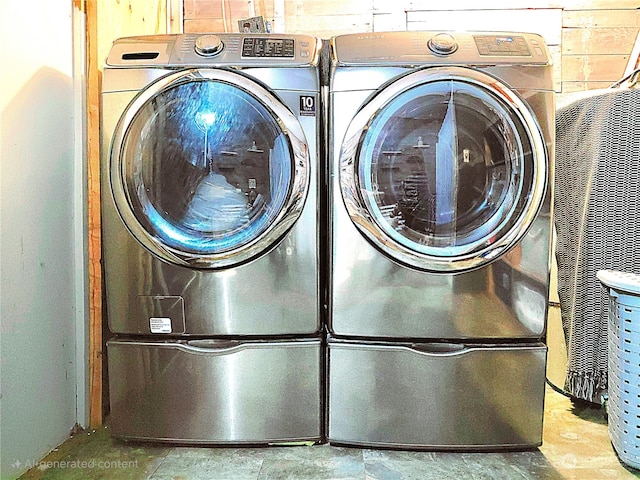 washroom with washing machine and dryer