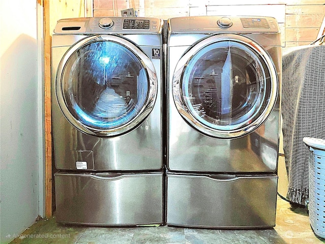 laundry area featuring washer and clothes dryer and laundry area