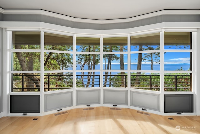 unfurnished sunroom featuring a wealth of natural light