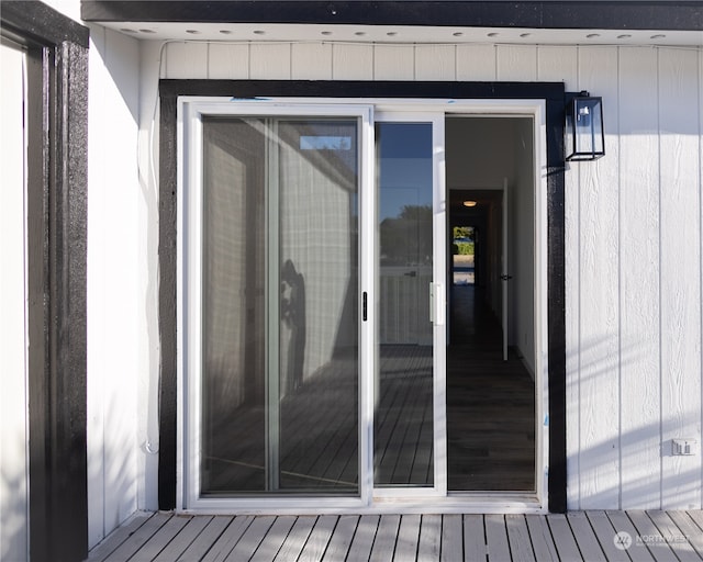 entrance to property with a wooden deck