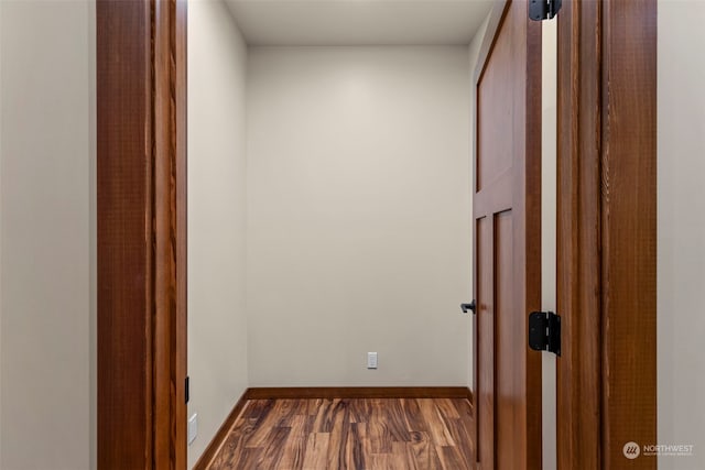 corridor featuring dark hardwood / wood-style flooring