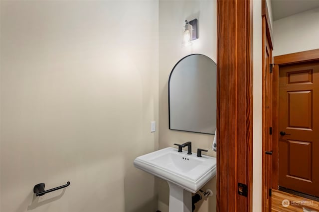 bathroom featuring hardwood / wood-style floors and sink