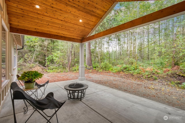 view of patio / terrace with an outdoor fire pit