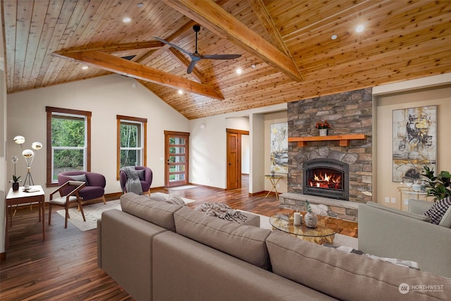 living room with beam ceiling, wooden ceiling, a stone fireplace, high vaulted ceiling, and hardwood / wood-style flooring