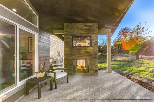 1690 Lilypad Pl E, Port Orchard, WA 98366 - view of patio / terrace with an outdoor stone fireplace