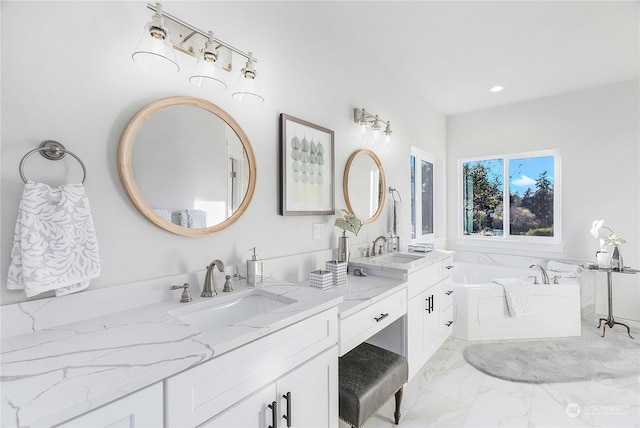 1690 Lilypad Pl E, Port Orchard, WA 98366 - bathroom featuring vanity, marble look tile flooring, a garden tub, and recessed lighting