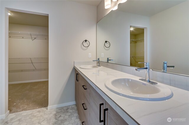 bathroom with tile patterned flooring and vanity