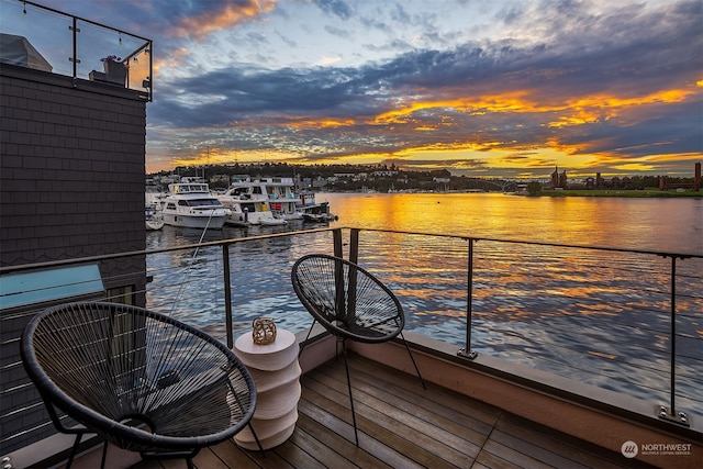 exterior space with a balcony and a water view