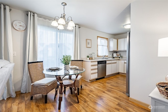 4232 Wintergreen Cir Unit 160, Bellingham, WA 98226 - dining area with a chandelier, light wood-style floors, and baseboards