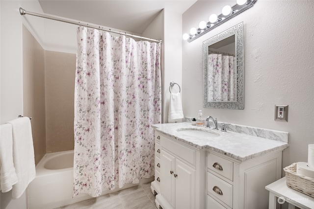 bathroom with tile patterned flooring, vanity, and shower / bathtub combination with curtain