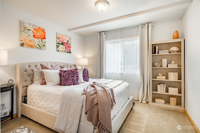 bedroom with light colored carpet