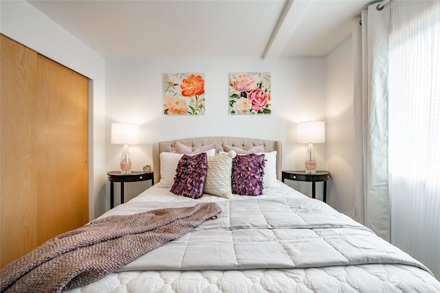 bedroom featuring beam ceiling