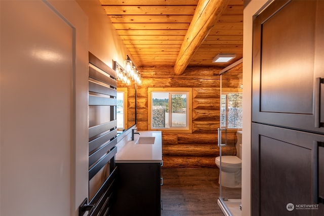 bathroom featuring beam ceiling, rustic walls, hardwood / wood-style floors, and wooden ceiling