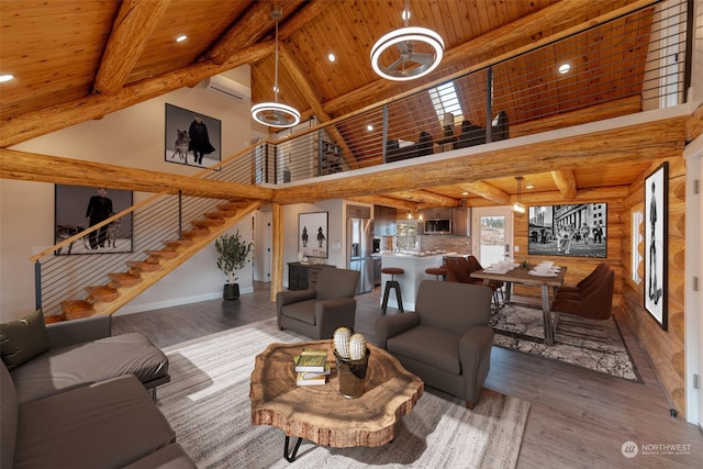 living room with high vaulted ceiling, hardwood / wood-style flooring, a wall mounted AC, beam ceiling, and wood ceiling