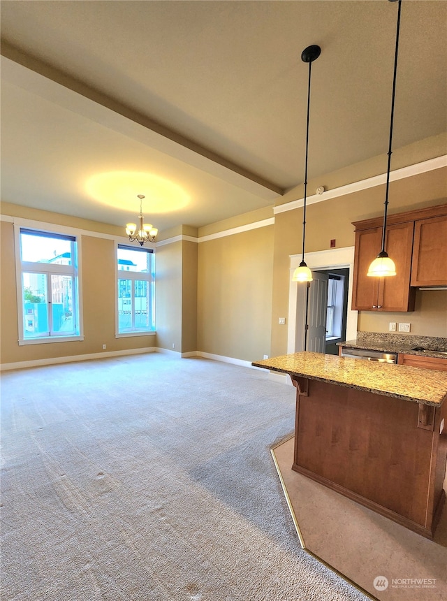 kitchen with light stone countertops, light carpet, pendant lighting, a breakfast bar area, and an inviting chandelier