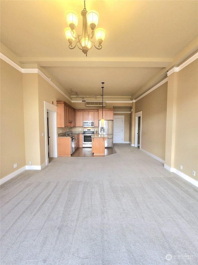 714 Market St Unit 303, Tacoma, WA 98402 - kitchen with baseboards, ornamental molding, a chandelier, open floor plan, and appliances with stainless steel finishes