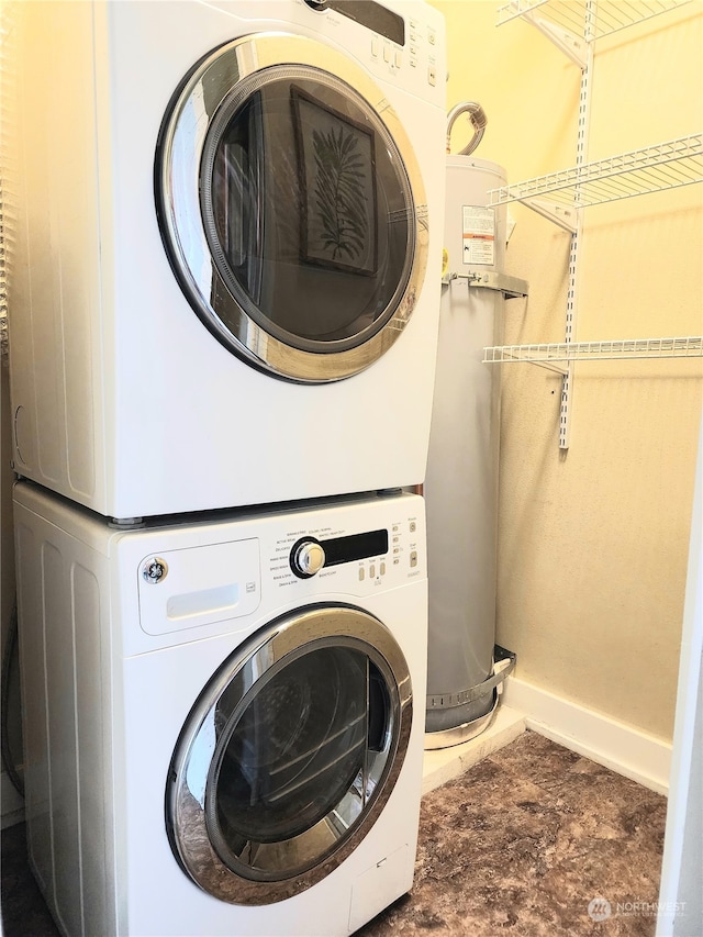 laundry area with stacked washer / dryer