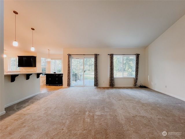 unfurnished living room with carpet flooring