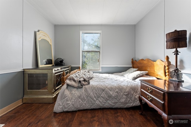 bedroom featuring dark hardwood / wood-style flooring