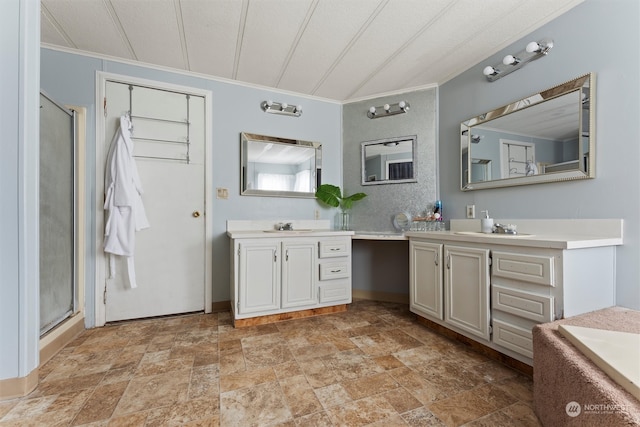 bathroom with ornamental molding, walk in shower, vanity, and a textured ceiling