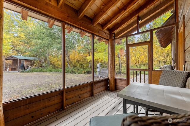 sunroom / solarium with lofted ceiling and wood ceiling