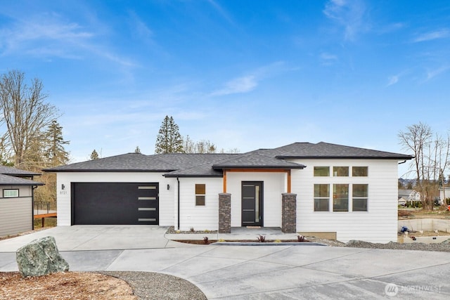 8721 Semiahmoo Dr, Blaine, WA 98230 - prairie-style house with an attached garage, a shingled roof, and concrete driveway